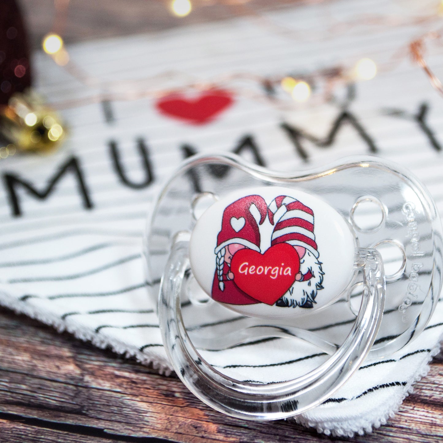 Personalised baby dummy with santa gongs.